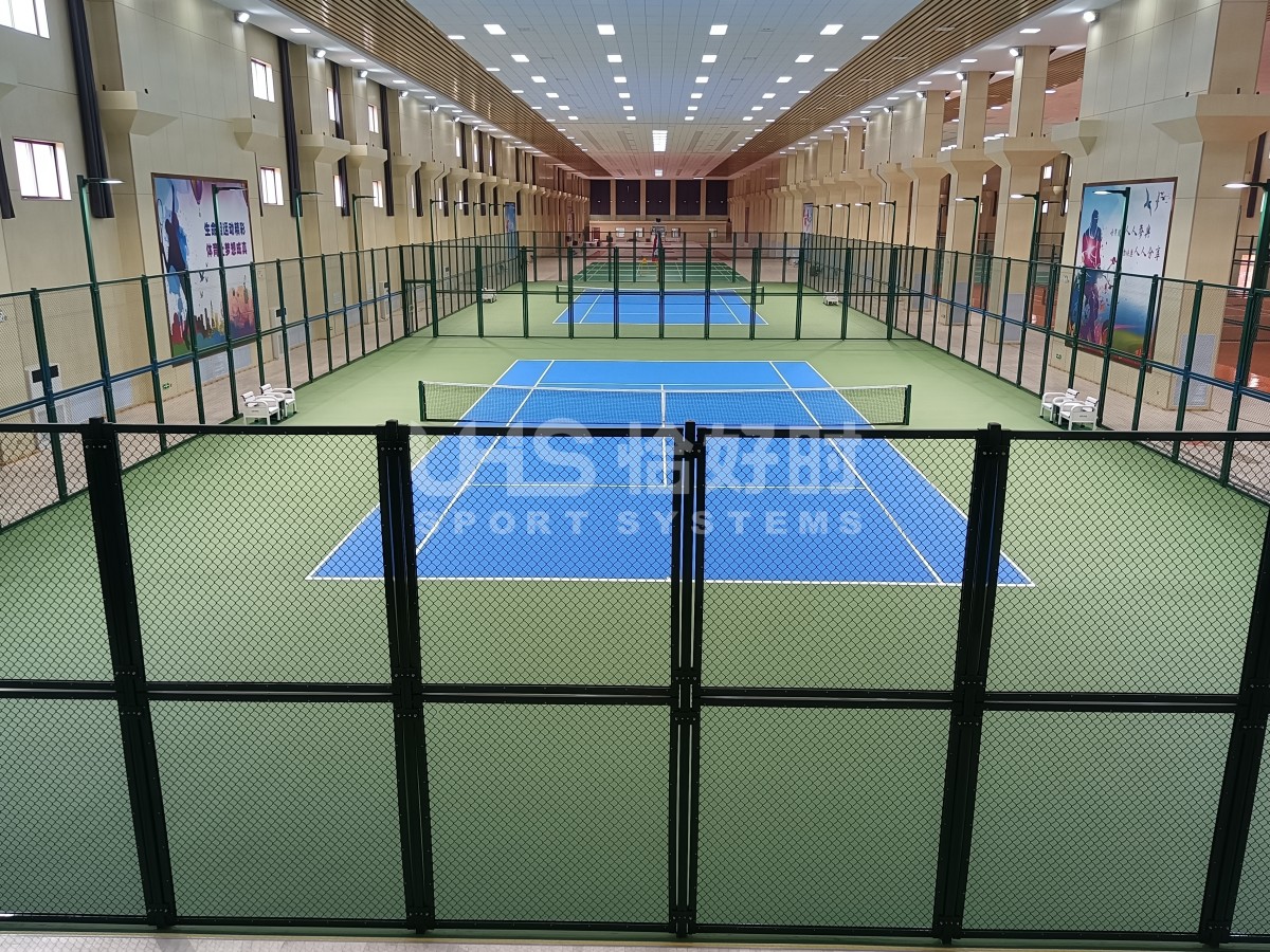 actual on-site photo showing multiple tennis courts connected together