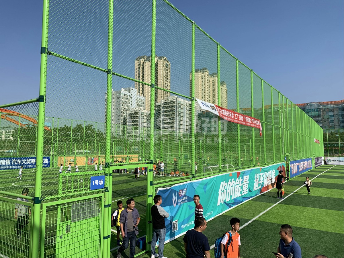 green color fence soccer field live match photo